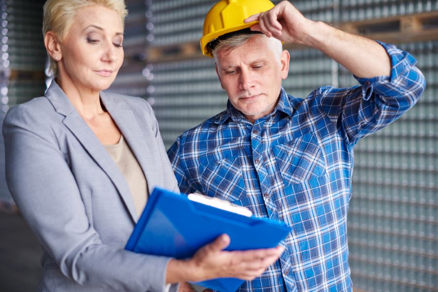 Two people working in warehouse