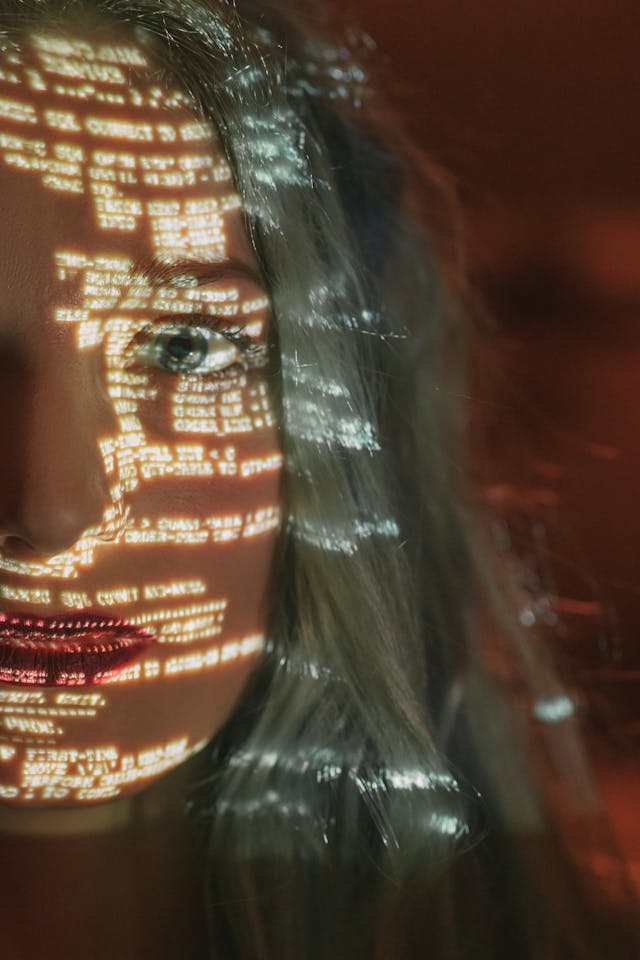 woman-with-text-projected-on-her-face-Extortion-Online 