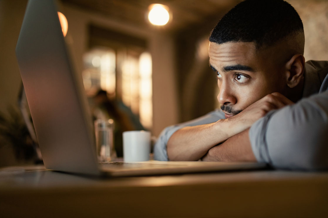 Man looking at his laptop screen