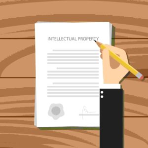 patent-intellectual-property-paper-with-hand-and-paper 