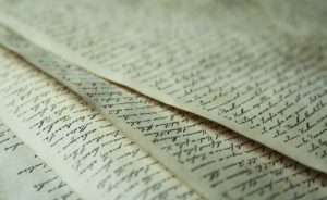 Antique documents covered in compact cursive writing.